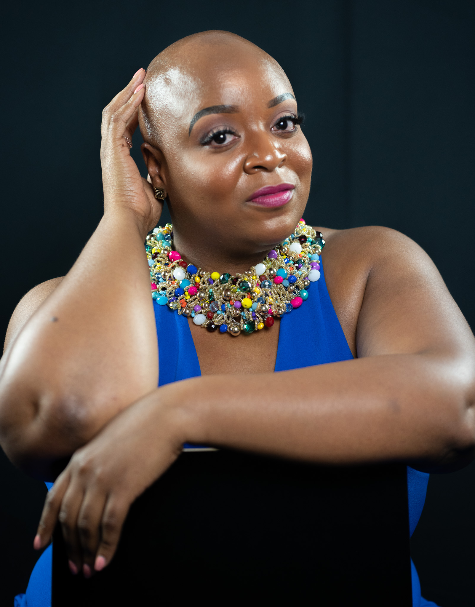 Studio portrait with statement beaded necklace